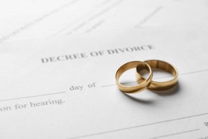 Divorce concept - rings on divorce papers